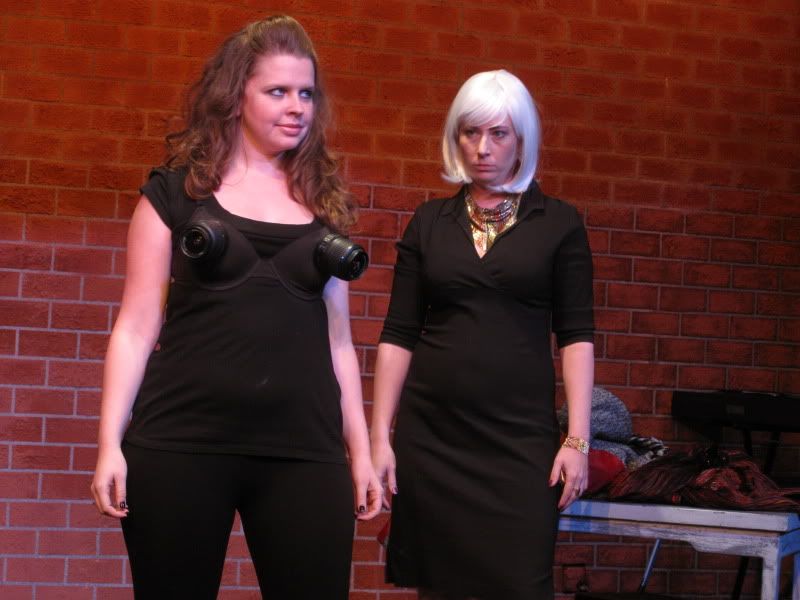 Enter Agent 7 (Nicole Monet), aka 'Photographic Mammary,' and Lucy Halfpence (Tifanie McQueen).