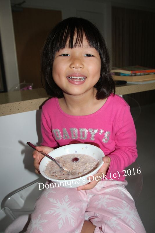 Tiger girl with her bowl of oats