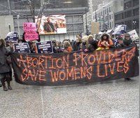 protest banner Abortion Providers Save Womens Lives
