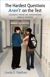 book cover of The Hardest Questions Aren't on the Test: Lessons from an Innovative Urban School by Linda F. Nathan. The book cover is a picture of a school hallway with Nathan talking with and putting her hand on the shoulder of a young male student of color.