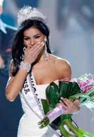 Rima Fakih covers her mouth with her hand after being crowned Miss USA