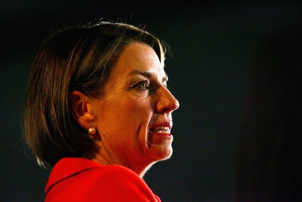Photo of Anna Bligh, speaking, wearing red suit