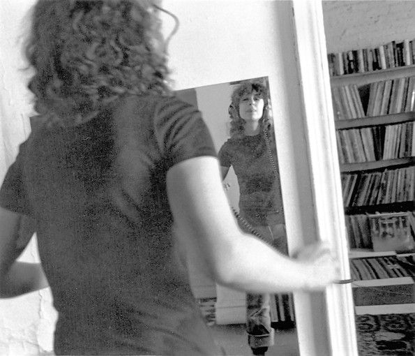 Ellen Willis dancing in front of the mirror