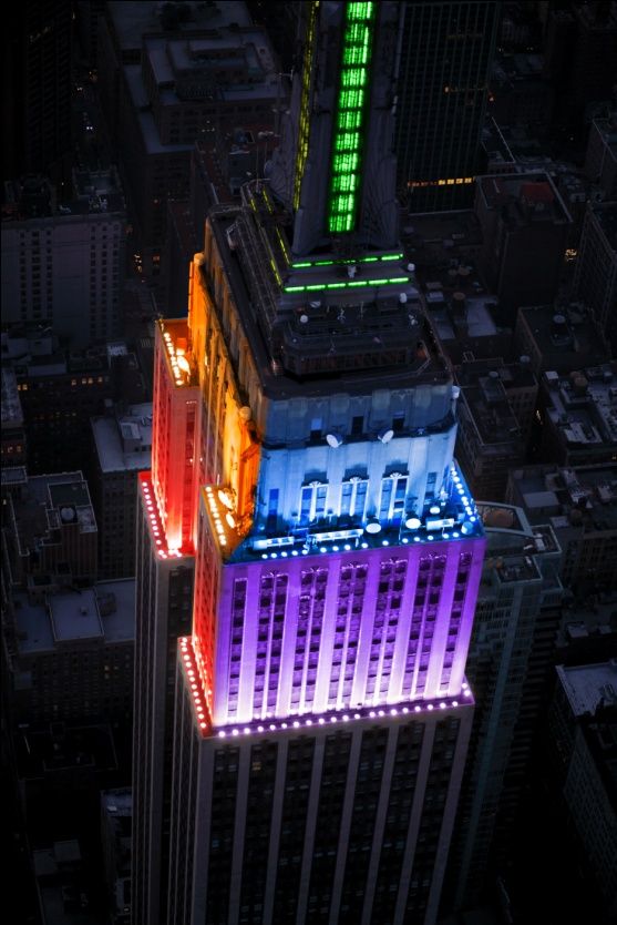 Empire State Building lit up with rainbow colors