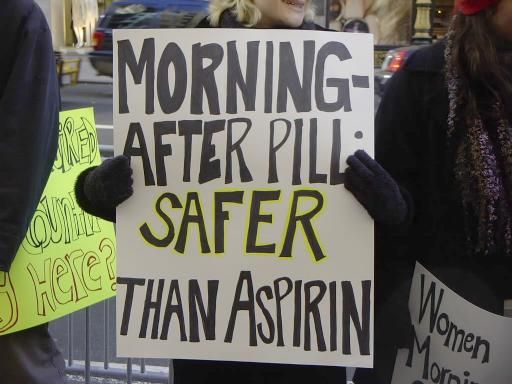sign that reads morning after pill is safer than aspirin