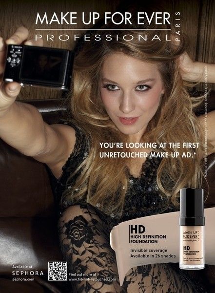 Thin blond white model takes a picture of her made up face. Copy reads You're looking at the first unretouched make up ad