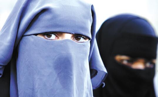 two women wearing veils