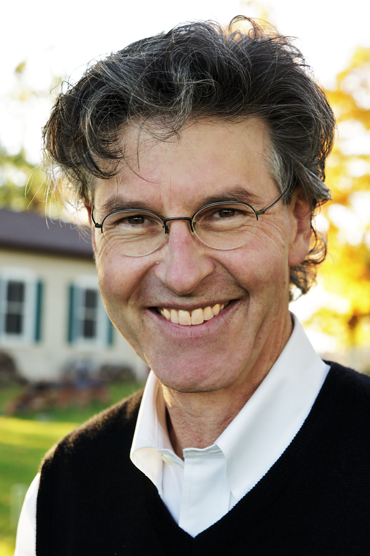 Michael Kaufman smiling in black sweater