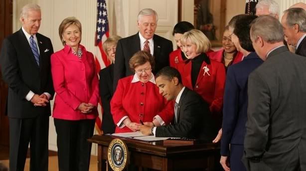 Obama signing the Lilly Ledbetter Act