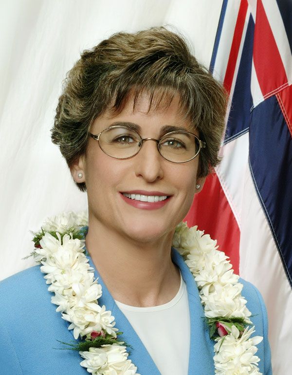 Governor Lingle smiling, wearing glasses and a ley