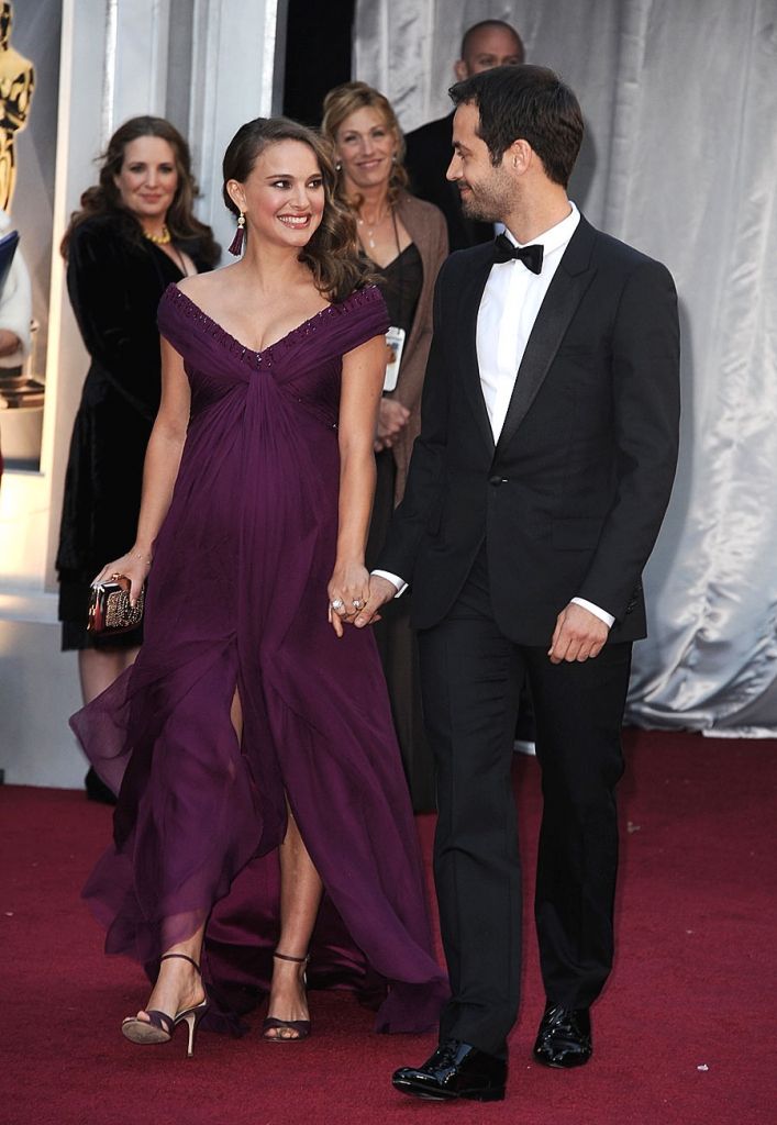 Natalie Portman and Benjamin Millepied hold hands on the Oscars red carpet