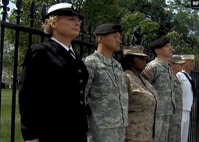 Six officers dressed in their military garb, chained to fence in front of White House