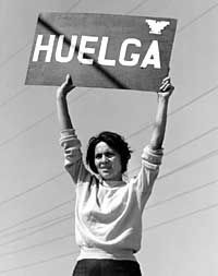 Dolores Huerta holds a sign reading Huelga, which means Strike, in a famous protest photo