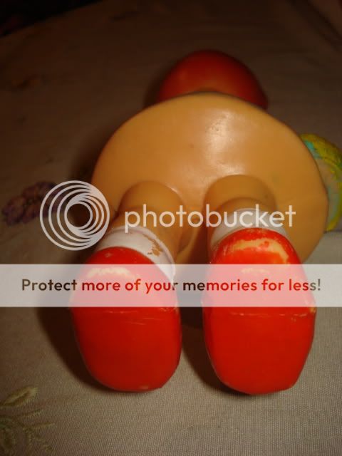 vintage old rubber doll whistling doll little red riding hood